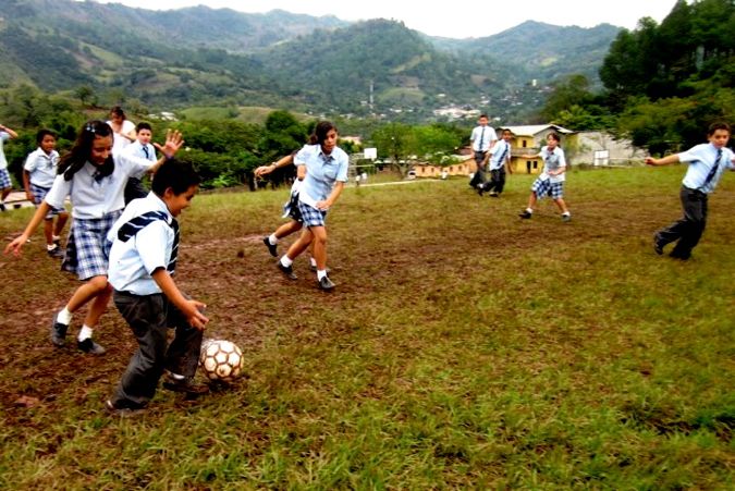 0830ov kids in Honduras playing on the local soccer field.jpg