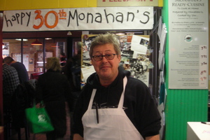 Borden - Mike Monahan in front of bday sign