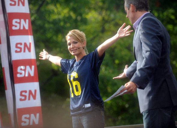 ESPN SportsNation cohost Michelle Beadle shows off her Denard Robinson 