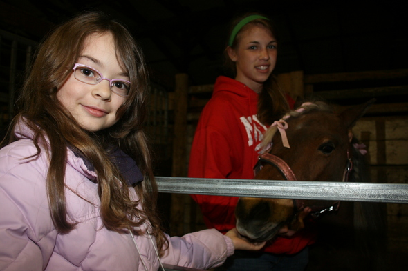 Miranda_Zak_pets_pony.JPG