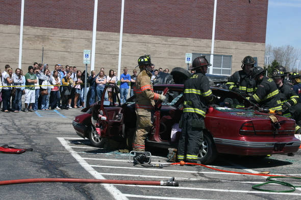 firefighters_work_on_car_students-Watch.JPG