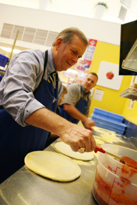 Congressman-Walberg-saucing-pizza-aug-24-2011.jpg