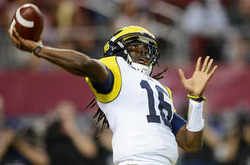 um-fb-denard-throw.jpg