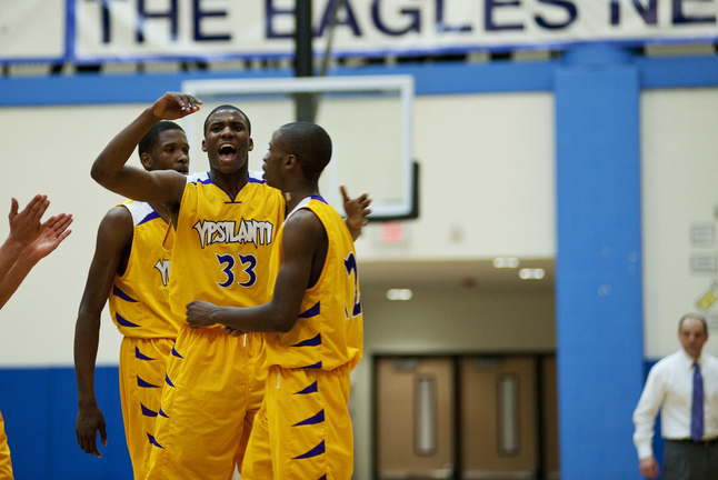 ypsilanti-boys-basketball-celebration-03042013.jpg