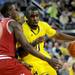 Michigan guard Tim Hardaway Jr., right, tries to dribble the ball past Indiana guard Victor Oladipo. Angela J. Cesere | AnnArbor.com
