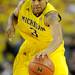 Michigan guard Trey Burke dribbles the ball down the court. Angela J. Cesere | AnnArbor.com
