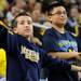11-year-old Ann Arbor residents Jordan Vergollo, left, and Ryan Herbert, dance to music during the second half of the basketball game against Indiana. Angela J. Cesere | AnnArbor.com
