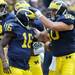 Michigan senior offensive lineman David Molk, right, celebrates with junior quarterback Denard Robinson after he scored a touchdown during the football game against San Diego State University at Michigan Stadium on Sept. 24, 2011. Angela J. Cesere | AnnArbor.com