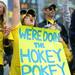 Michigan alumna Sarah Williams holds up a "Hokey pokey" sign during the football game against San Diego State at Michigan Stadium on Sept. 24, 2011. Angela J. Cesere | AnnArbor.com