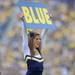 A Michigan cheerleader holds up a "blue" sign for a cheer during the football game against San Diego State at Michigan Stadium on Sept. 24, 2011. Angela J. Cesere | AnnArbor.com