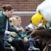 Eastern Michigan color guard member Shayla McDermott dances with Eastern's eagle mascot, Swoop before the football game against Michigan at Michigan Stadium on Saturday. Angela J. Cesere | AnnArbor.com