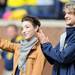 University of Michigan students and olympic ice dancing medalist Meryl Davis and Charlie White wave to fans during a break in the football game against Eastern Michigan at Michigan Stadium on Saturday. Angela J. Cesere | AnnArbor.com