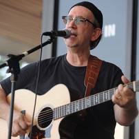 Performing songwriter Bill Edwards sang and played guitar during the AnnArbor.com Summer Concert Series on Friday afternoon. Angela J. Cesere | AnnArbor.com 
