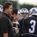Pioneer lacrosse head coach James Corey talks to his team during a time out at the MHSAA lacrosse semi-finals game against Holt at Parker Stadium in Howell, Mich. on Wednesday evening. Angela J. Cesere | AnnArbor.com