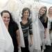 From left: The Brides Project designer and brander Kellie Bambach, Executive Director Barb Hiltz, Marketing Co-Chair Ashley Edwards, and The Brides Project Co-Chair Monique Sluymers stand with wedding gowns inside of their space on W. Liberty on Sept. 13, 2011. Angela J. Cesere | AnnArbor.com