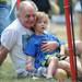 Ann Arbor resident Paul Winston holds his grandson, Ypsilanti resident Joey Ball, while watching sword fighting put on by the Society for Creative Anachronism at the Saline Celtic Festival. Angela J. Cesere | AnnArbor.com 