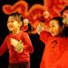 6-year-old first graders Christine Shu, right, and Allison Yen dance during the "Health Song."  Angela J. Cesere | AnnArbor.com
