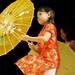 8-year-old Selina Lin does a dance with an umbrella during the Chinese New Year celebration. Angela J. Cesere | AnnArbor.com
