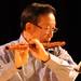 Tao Chen, a member of the Dizi class, plays a bamboo flute during the Chinese New Year celebration. Angela J. Cesere | AnnArbor.com
