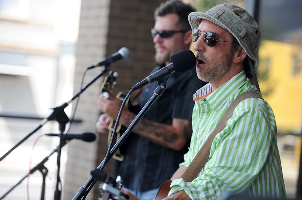 Musician Dave Boutette, right, sings and plays guitar with Jason Dennie on the mandolin at the AnnArbor.com summer concert series on the patio at Fifth Ave. and Liberty in Ann Arbor. Angela J. Cesere | AnnArbor.com 