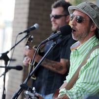 Musician Dave Boutette, right, sings and plays guitar with Jason Dennie on the mandolin at the AnnArbor.com summer concert series on the patio at Fifth Ave. and Liberty in Ann Arbor. Angela J. Cesere | AnnArbor.com 