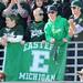 From right: Eastern Michigan students Marc Carnacchi, Matthew Burton, Jacob Kohlhorst, and Stephen Pawelczyk cheer with an EMU flag in the student section. Angela J. Cesere | AnnArbor.com