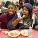 Huron substitute teacher Portia Mathews, right, poses for a photo with 16-year-old Huron special education student Alexis Marable during the Fall Feast. AnnArbor.com | Angela J. Cesere
