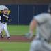 Michigan freshman Dylan Delaney tries to beat the Coastal Carolina runner to first base. Angela J. Cesere | AnnArbor.com