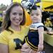 Michigan alumna Raquel Clayton holds her 14-onth-old daughter Samantha dressed in a Michigan cheerleader outfit before the Michigan football game against Notre Dame on Sept. 10, 2011. Angela J. Cesere | AnnArbor.com