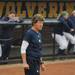 Michigan head coach Carol Hutchins takes a look at the field in-between batters.  Angela J. Cesere | AnnArbor.com
