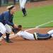 Penn State 3rd baseman Liz Presto waits for the ball while Michigan infielder Taylor Hasselbach slides into the base after hitting a double. Angela J. Cesere | AnnArbor.com
