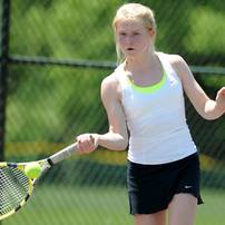 Huron's Hanna Ljungman swings at the ball in the 2 doubles match against Saline at a tournament at Pioneer High School on Wednesday afternoon. Angela J. Cesere | AnnArbor.com