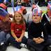 From right: Kindergarten students Dylan Andrews, Cole Buescher, Makenzie Billings, and Brendan Smith wear star spangled banner themed hats at the ceremony to honor veterans. Angela J. Cesere | AnnArbor.com