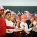 Kindergartner Joiya Keith, far left, sings with classmates to "This Land is Your Land". Angela J. Cesere | AnnArbor.com