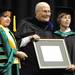  Washtenaw Community College president Dr. Rose Bellanca, left, and board member Pamela Horiszny, right, hand congressman John Dingell his honorary associate degree in community service during the WCC commencement ceremony held at Eastern Michigan University's Convocation Center on Saturday morning. Angela J. Cesere | AnnArbor.com