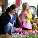 4-year-old Dexter resident Theresa Tippens, right, and her mom Melissa pick out flowers for their garden at J and T Garcia's Greenhouse stall at the Ann Arbor Farmer's Market. Angela J. Cesere | AnnArbor.com