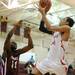 Willow Run's Jamal Poplar, right, takes a shot above River Rouge's James Walker. Angela J. Cesere | AnnArbor.com
