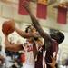 River Rouge's James Walker, right, tries to block a shot by Willow Run's Kareem Lovelance Jr. Angela J. Cesere | AnnArbor.com
