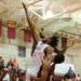 Willow Run's NyShaun Marks, center, fights River Rouge's Resean Coleman for the rebound. Angela J. Cesere | AnnArbor.com
