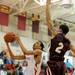 River Rouge's Chase Gonzales, right, jumps up to block Willow Run's Jamal Poplar's shot. Angela J. Cesere | AnnArbor.com
