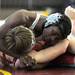 Pioneer's Quandre Thomas, top, tries to pin Michigan Center's Daytan Pater during the 135 lb weight class match. Angela J. Cesere