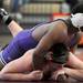 Pioneer's Jahi Hilliard, top, tries to turn over Michigan City's Presley Kellogg during the 215 lb weight class match. Angela J. Cesere