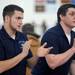 Skyline coaches Mike Maguire, left, and Jeff Millman cheer on a Skyline wresler from outside the ring. Angela J. Cesere