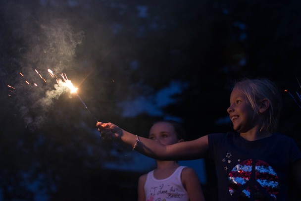 8-year-old Lilli Howe plays with a sparkler before Manchester's annual fireworks show at Carr Park, July 3.
Courtney Sacco I AnnArbor.com