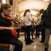 Forsythe seventh-grader Gabrielle Hornak practices her violin in the lobby of the Hill Auditorium before the start of Orchestra night Thursday, Feb. 14. 
Courtney Sacco I AnnArbor.com 