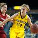 Wolverines Jenny Ryan dribbles the ball past Cornhuskers Lindsey Moore as she heads to the basket during the second half of their game Thursday night.
Courtney Sacco I AnnArbor.com     