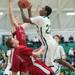 Huron's Xavier Cochran fouls Bedford's Dylan Barr as he jumps to try and make a basket during second half of their game Thursday evening at Huron High School.
Courtney Sacco I AnnArbor.com 