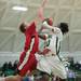 Huron's Demetrius Sims jumps as he tries to make a basket but is blocked by a Bedford player during second half of their game Thursday evening at Huron High School.
Courtney Sacco I AnnArbor.com 