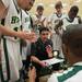 Huron's Head Coach Waleed Samaha talks to his players during a time out.
Courtney Sacco I AnnArbor.com 