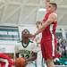 Huron's Xavier Cochran jumps to make a shot against Bedford's during first half of their game Thursday evening at Huron High School.
Courtney Sacco I AnnArbor.com 